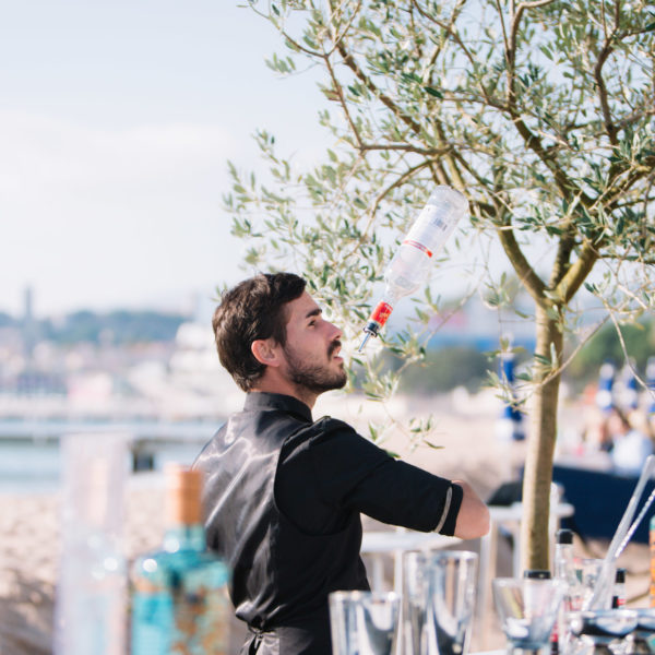 Flare bar tender operating on the beach during a corporate lunch during MAPIC in Cannes