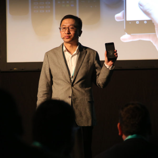 Speaker introducing phone on stage during product launch in barcelona during MWC
