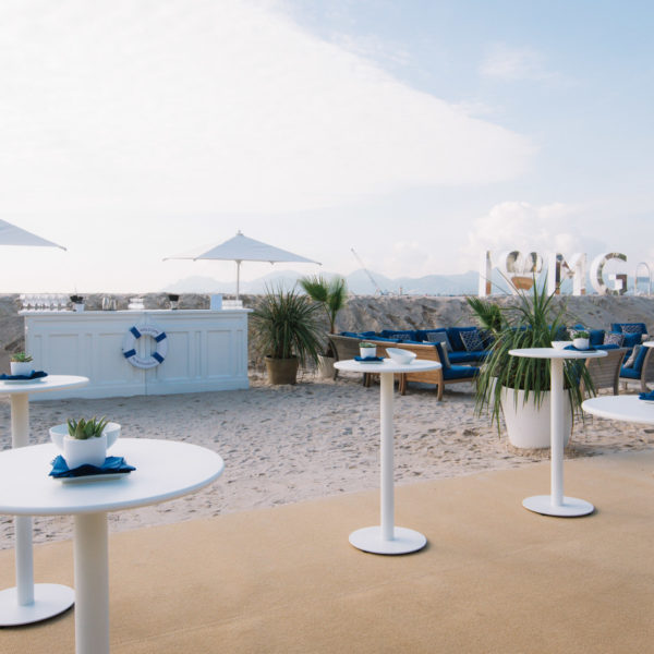 High tables and bar on the beach sisal carpet