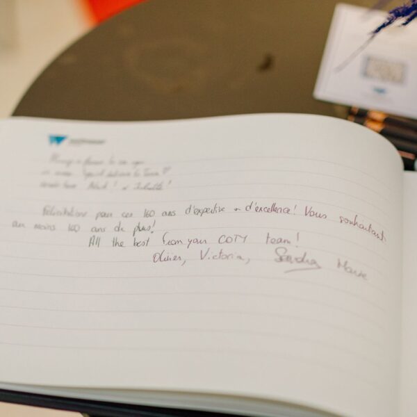 guest book displayed on a table where each guests could leave a note