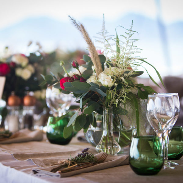 bucolic design with floral center pieces during MAPIC on the beach