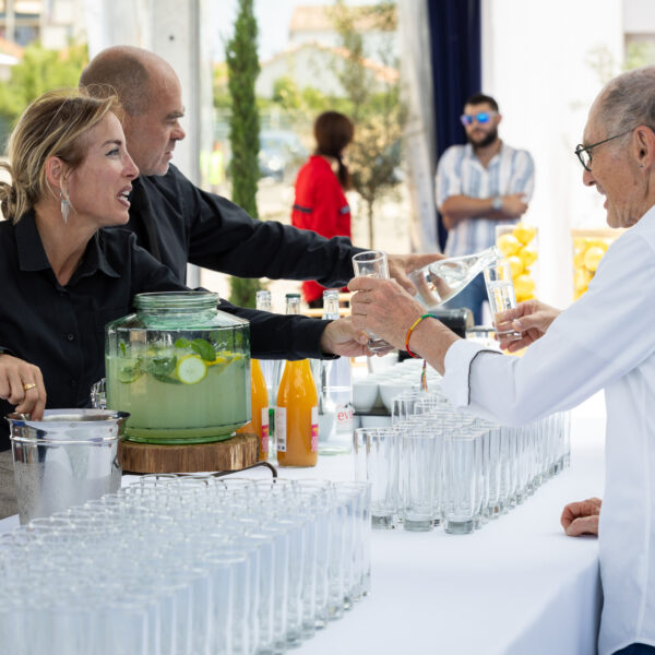 Waitress serving a guest during the networking part of the inauguration event