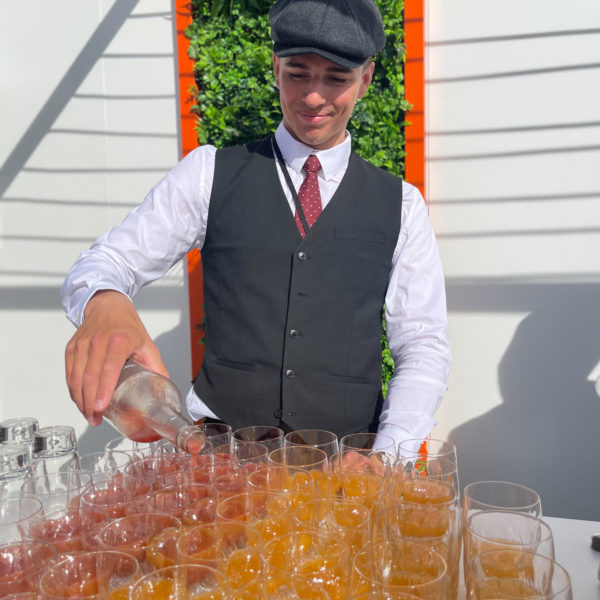 Flair bar tender preparing cocktails at the booth during MIPIM