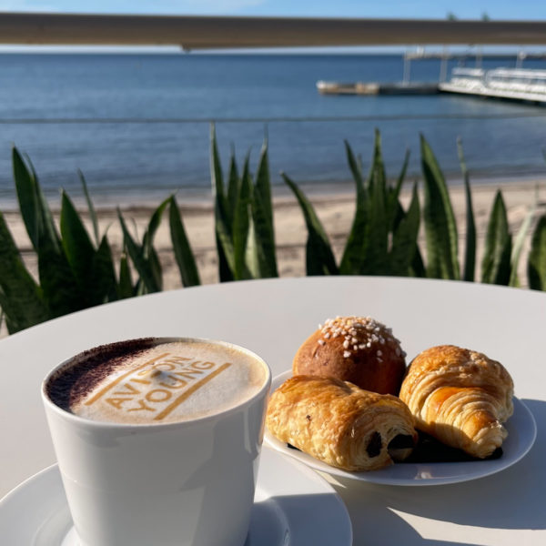 Branded Coffee, croissants and other pastries with the view over the baie from the booth in the palais des festivals