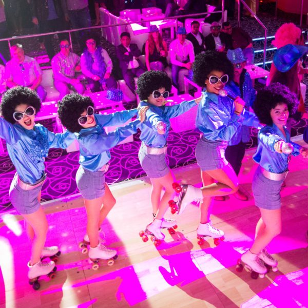 Disco roller girls performing during the theme party in Nice