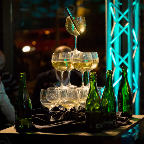 Glasses of champagne displayed as a fountain with a mobile phone in the top glass during Product launch in Barcelona during MWC