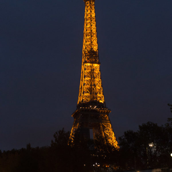 Paris Eiffel tower lighted up at night during the cruise on the Seine during the networking event of the innovation summit