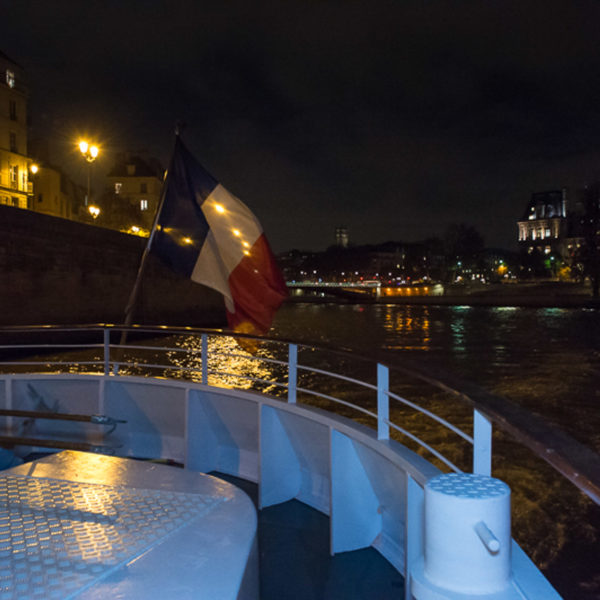 french flag at the end of the barge during the cruise of the innovation summit