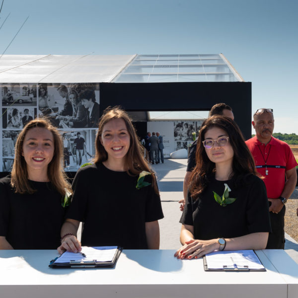 Hostesses in front of the tent to welcome the guests for the ground breaking ground