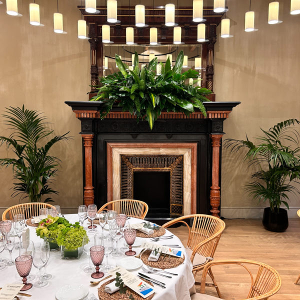 fireplace with flower arrangement for exclusive dinner in private venue for a corporate exclusive dinner during MWC