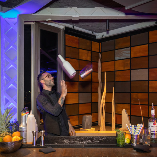 flair bar tender performing during networking event in barcelona city center