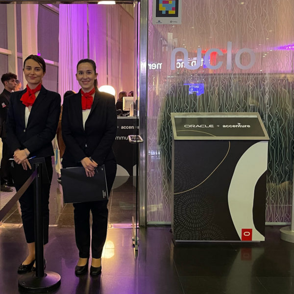 happy hour entrance with customer branding and three hostesses to filter the guests at mwc