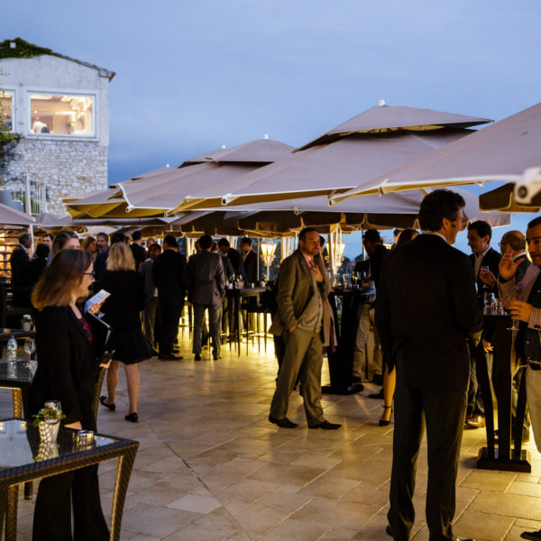 Guests mingling on the terrace during the exclusive event DTW