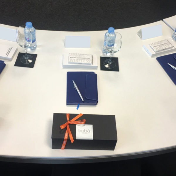 Board meeting table with gifts during MWC