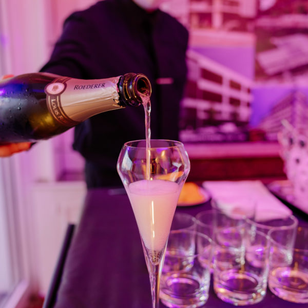 Champagne pouring in a glass during MIPIM party