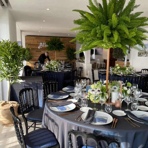 MIPIM dinner set-up with trees plants and center pieces