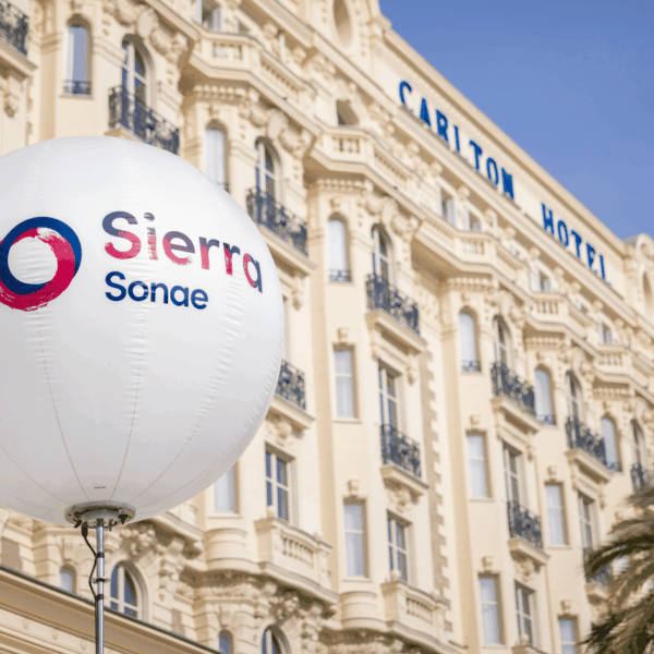 Customer ballon with logo on the first part of the picture, Carlton hotel logo on the building in the background