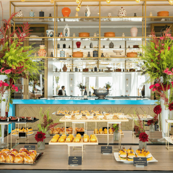 Buffet elegantly dressed up with beautiful flower compositions on each side