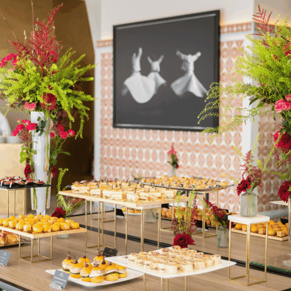 Buffet elegantly dressed up with beautiful flower compositions on each side