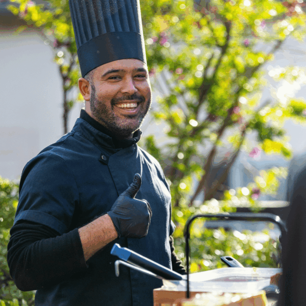 Chef smiling at the photographer during lunch reception during MIPIM
