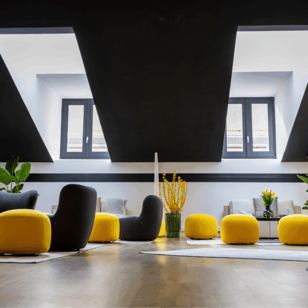 Lounge area design furniture with mimosa flowers inside the hospitality suite