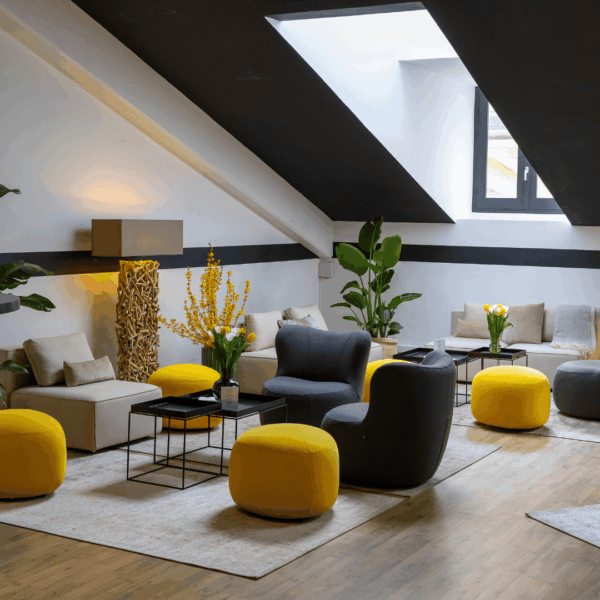 Lounge area design furniture with mimosa flowers inside the hospitality suite