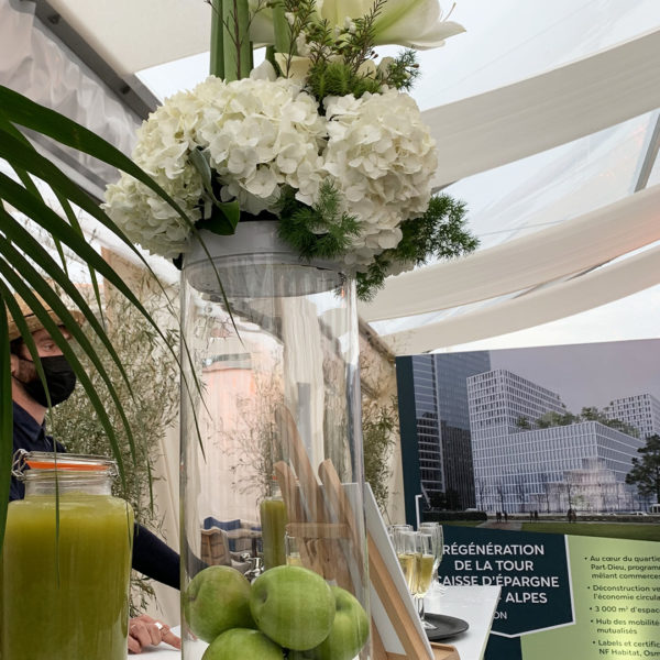 Green flower arrangement on bar during happy hour on the beach at MIPIM 2022 in cannes