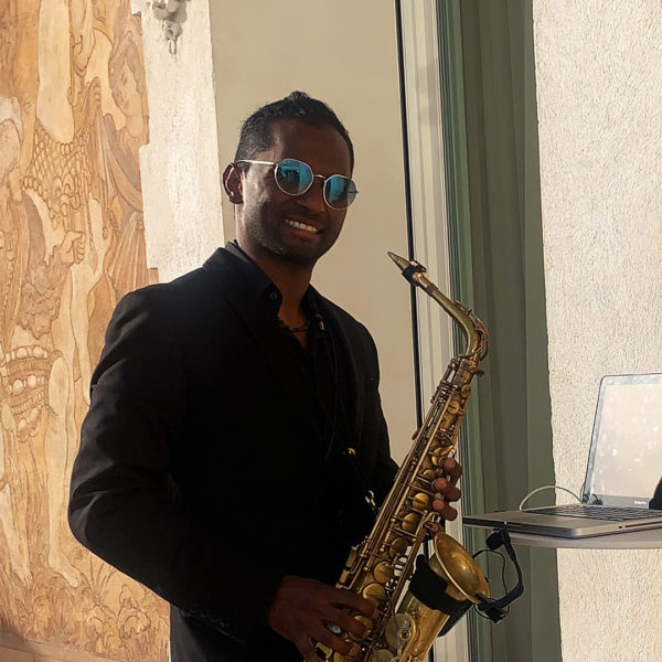 Saxo player during MIPIM on terrace