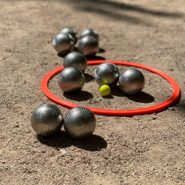 Pétanque balls in orang circle on the field during a break