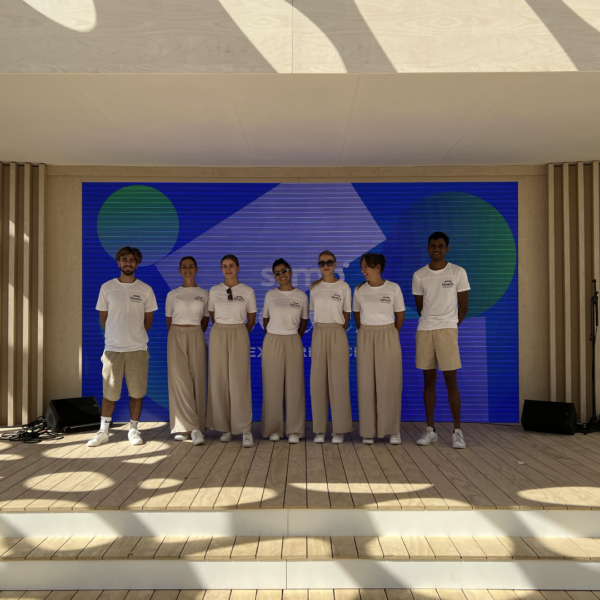 Team in front of the giant led screen during Cannes Lions