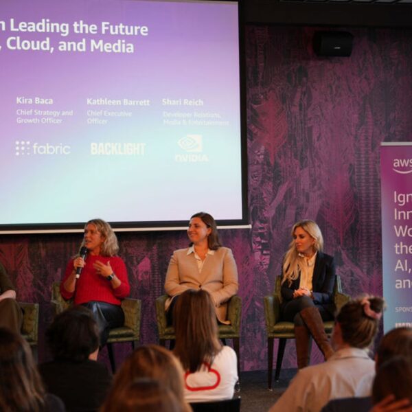 panelists on stage during the session exchanging