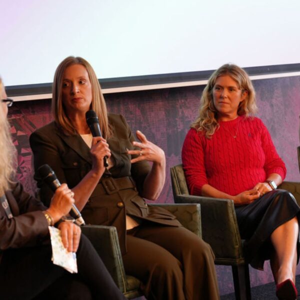 panelists on stage during the panel session by the canals in Amsterdam during IBC