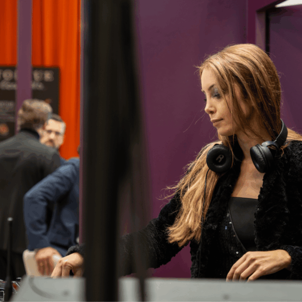 DJ at the booth mixing sound during the happy hour