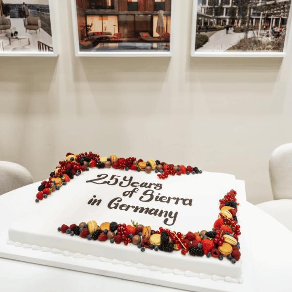 Anniversary cake with wording and fruits at the stand during Expo Real for an on site celebration