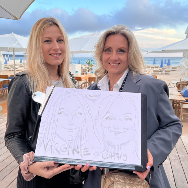 drawing caricaturist art during corporate event