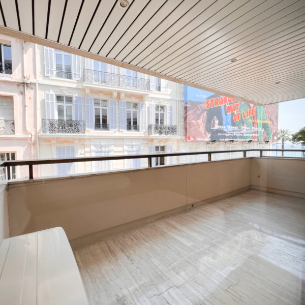 Balcony adjacent to a bedroom in refurbished flat on the croisette in Cannes