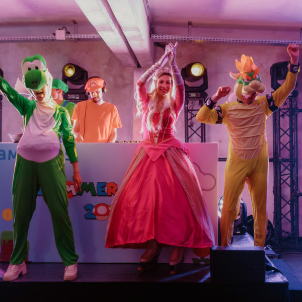 mario, yoshi, princess peach, bowser and the dj dancing and galvanizing the crowd
