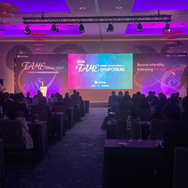 global view of the medical conference room including classroom tables for 130 pax a 17 meters stage a 5,5 meters LED screen and beautiful purple lighting