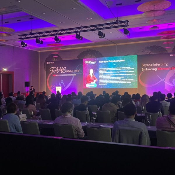 global view of the medical conference room including classroom tables for 130 pax a 17 meters stage a 5,5 meters LED screen and beautiful purple lighting