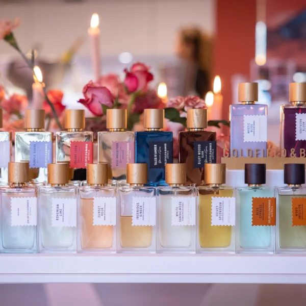 TFWA cocktail reception, perfumes collection displayed with gorgeous decoration in the background made of flowers and candles