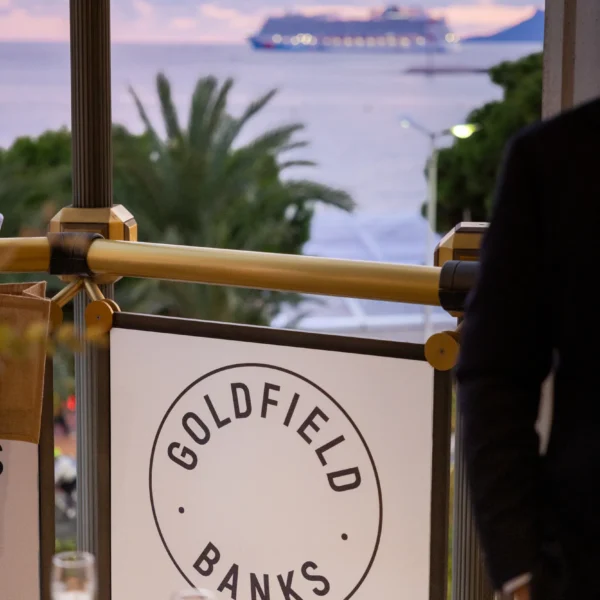 branded terrace on the croisette at sunset with a beautiful pink an purple sky and yachts
