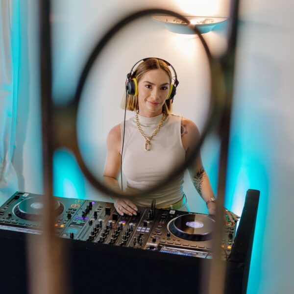 a female Dj was playing some chic lounge music during the evening