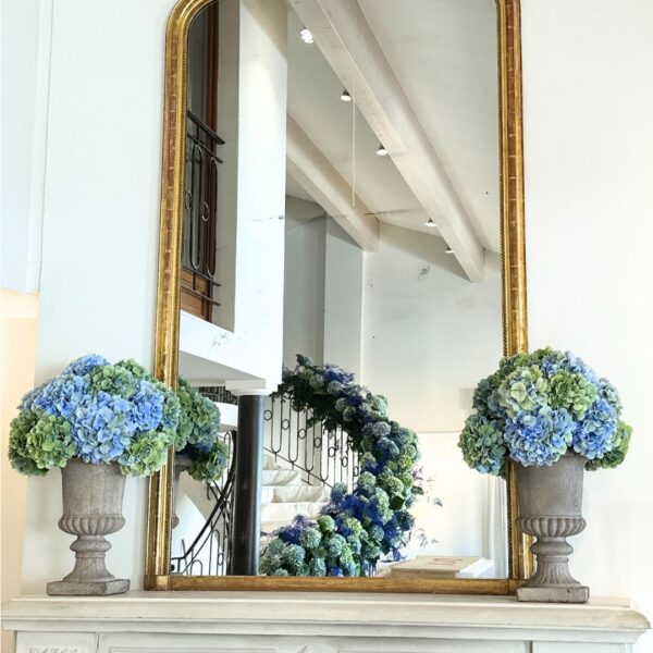 mirror in hospitality in Cannes with flowers reflection from the venue decoration